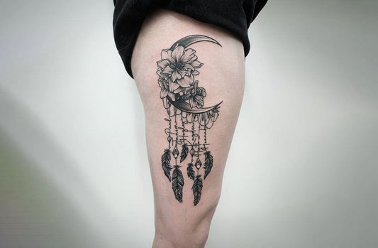Thigh tattoo idea for women